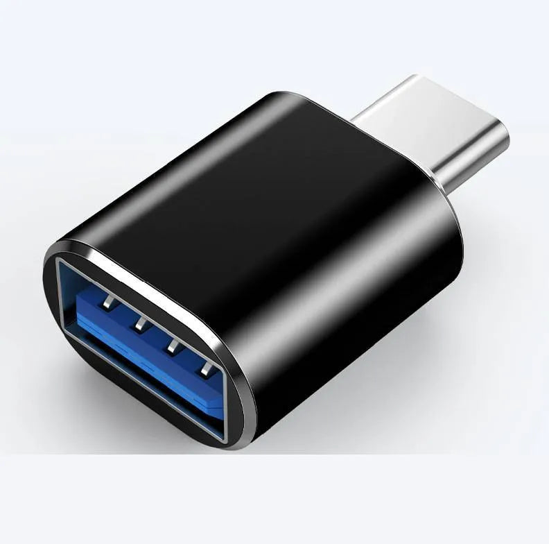 USB Type-C male to USB-A female OTG adapter shown in black, silver, and gold colour options.