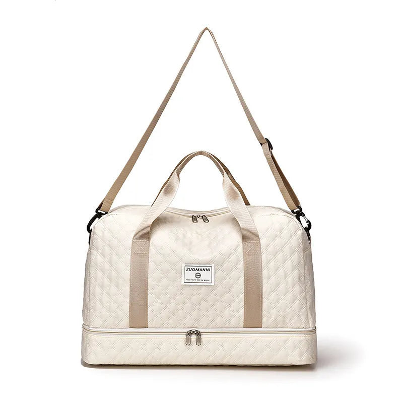 Large Oxford cloth travel bag in a solid colour showing its spacious design and street style details.