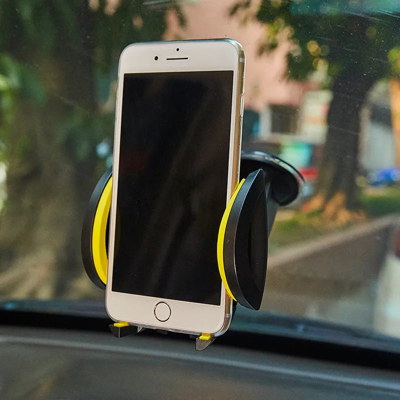 Red U-shaped suction cup mobile phone holder for car or desk with wide clamp arm on black background.