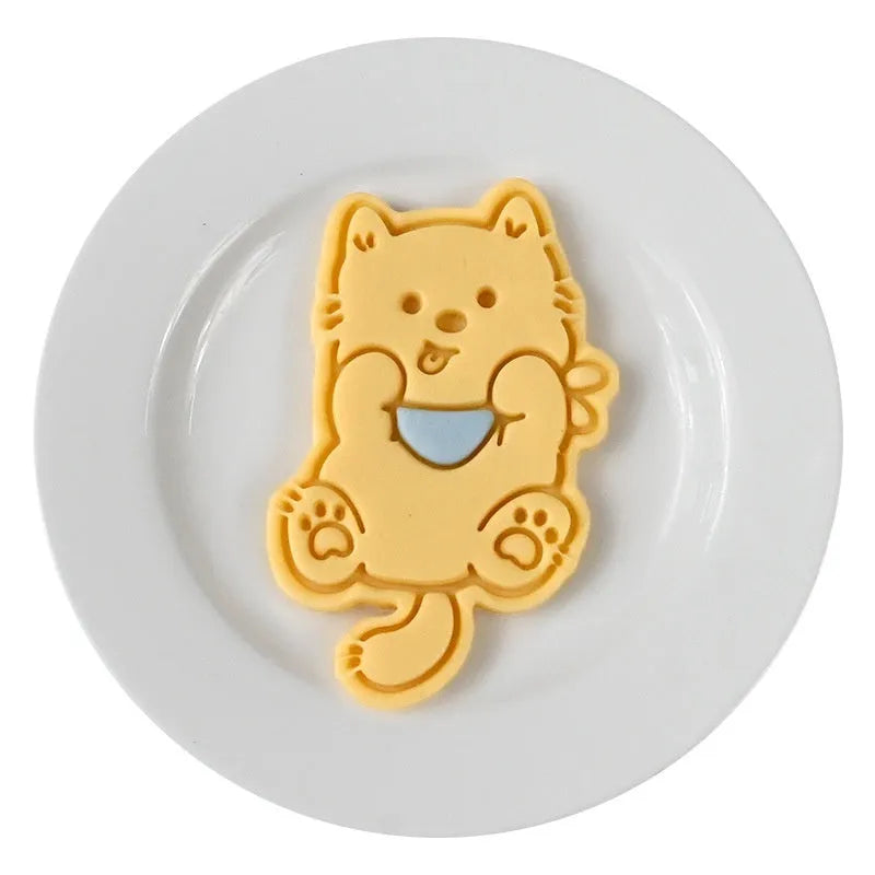 Three dimensional plastic puppy cartoon biscuit mould showing character designs