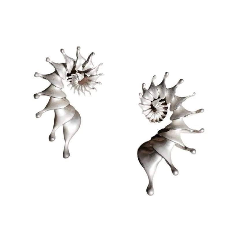 Matte finish conch stud earrings with exaggerated three-dimensional alloy design