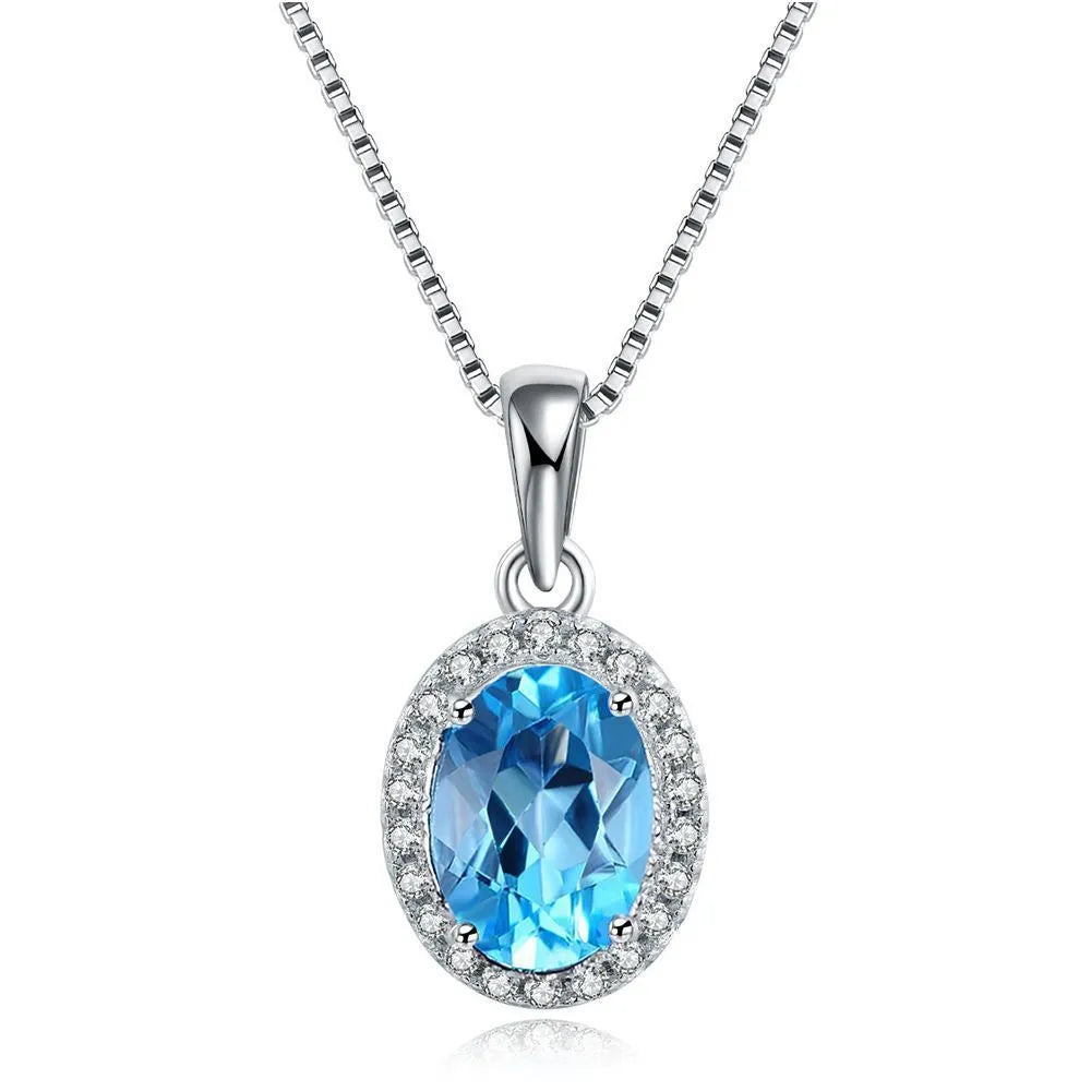 925 sterling silver jewellery set with Blue Topaz stones in geometric design including earrings, ring, pendant and necklace