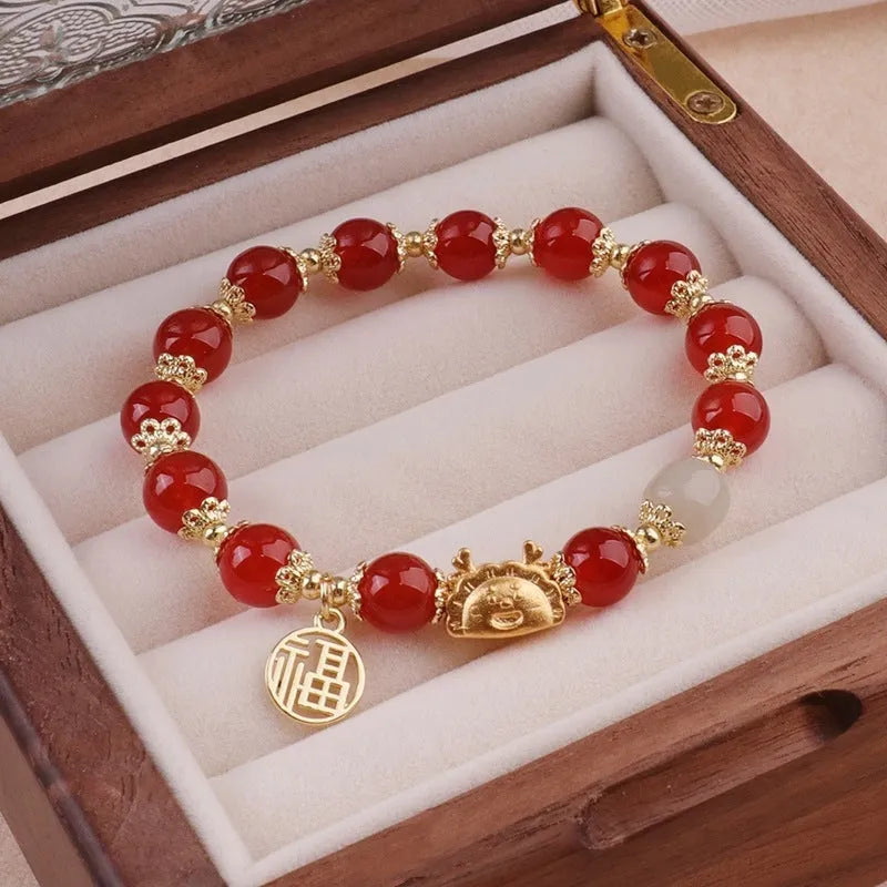 Glass floral glazed bracelet with animal zodiac modelling and electroplated red bead finish