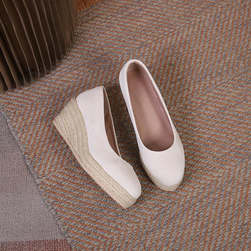Wedge heel pumps with thick sole and rope detail in apricot, showing shallow cut design.