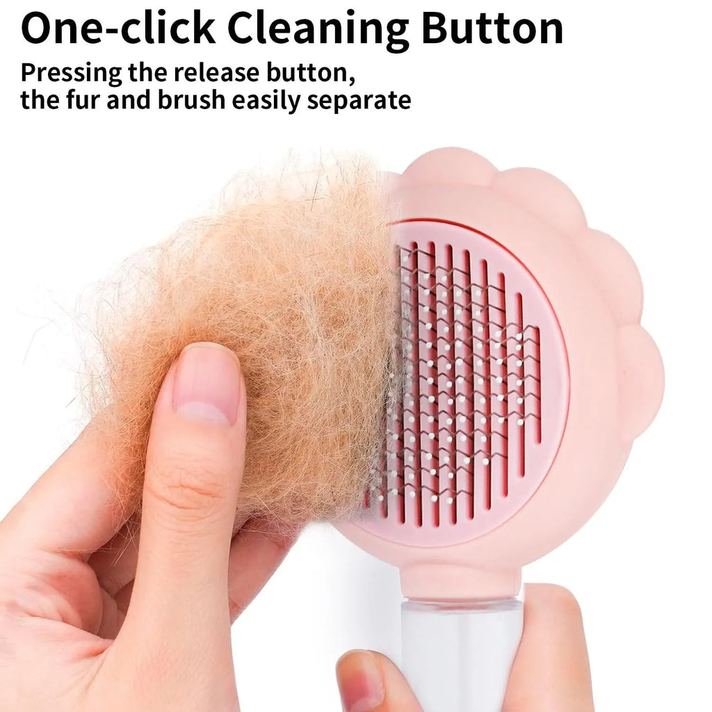 Grey spray cat grooming brush with self-cleaning button and stainless steel bristles on a white background
