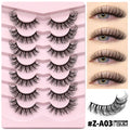 Box of natural false eyelashes with thick artificial fibre lashes and glue tube