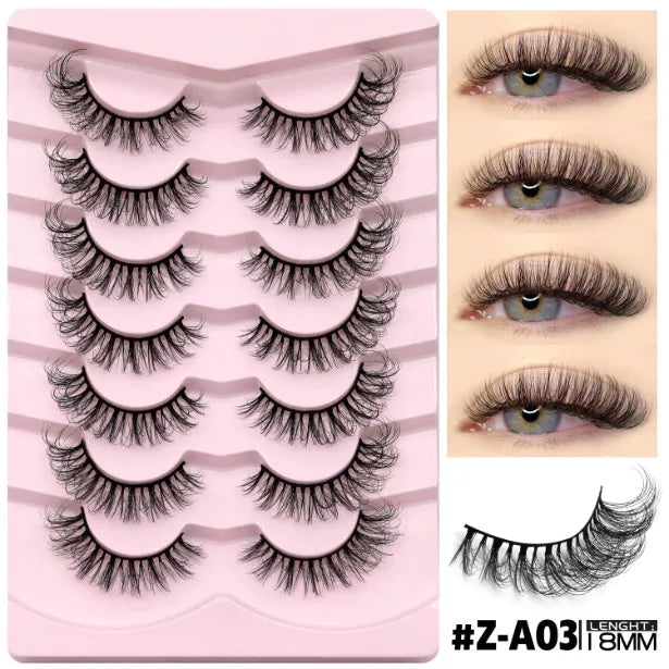 Box of natural false eyelashes with thick artificial fibre lashes and glue tube