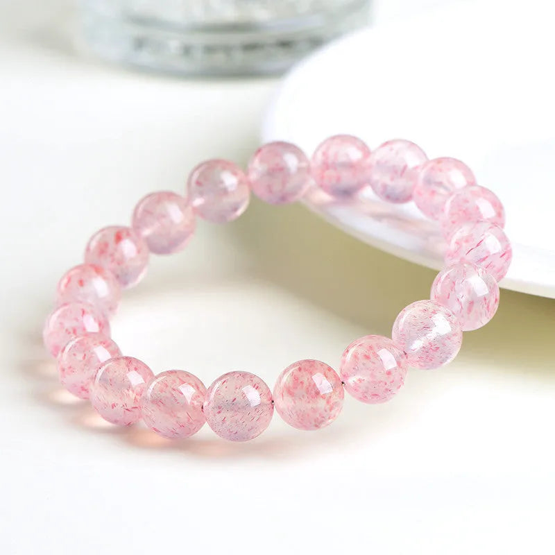 Strawberry quartz crystal bracelet with 10mm polished beads on elastic string