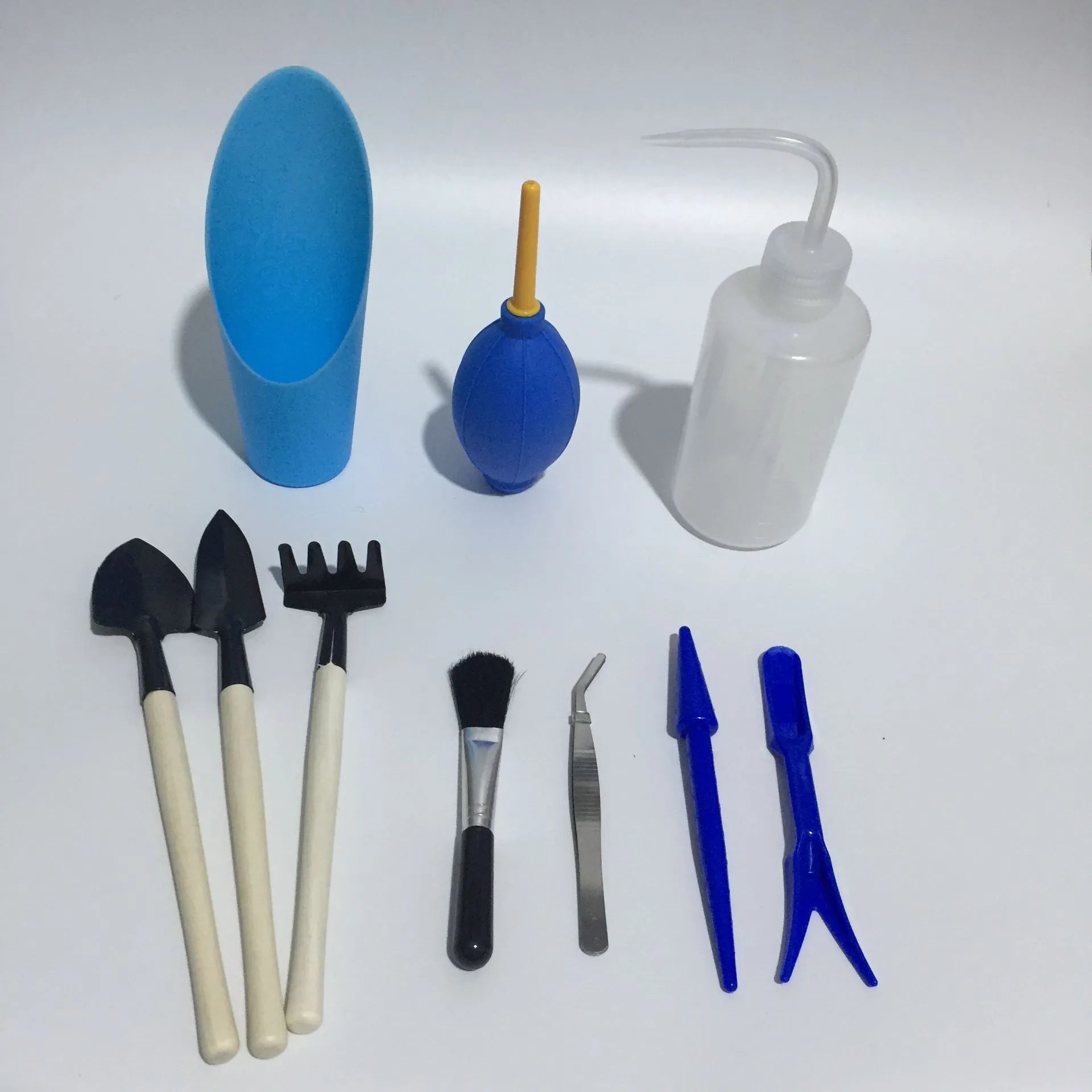 14-piece succulent gardening tool set showing watering can, mini shovels, tweezers, and soil tools for indoor plant care