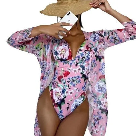 Women's floral print bikini three-piece set with halter-neck top and matching cover-up