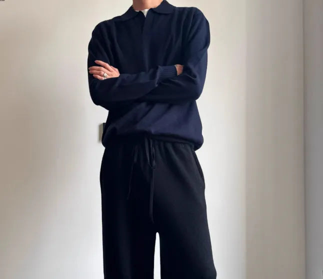 Man's milky white pure wool polo sweater with a lapel collar, shown in a loose fit.