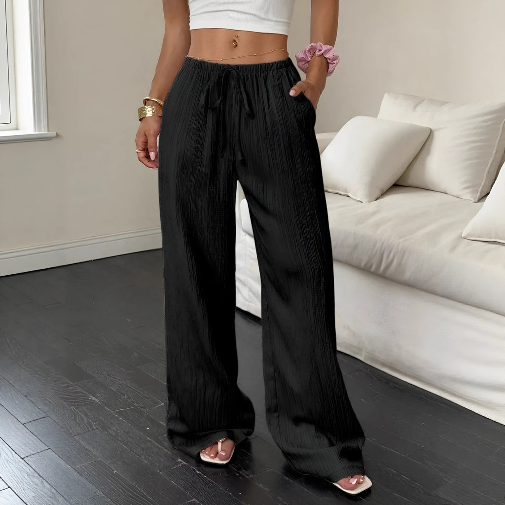 Women's black wide-leg trousers with lace-up waist detail front view