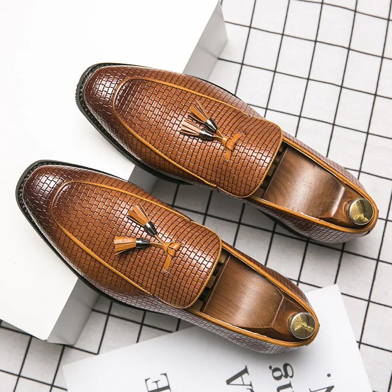 Men's black pointed slip-on business shoes with tassel detail on artificial PU upper