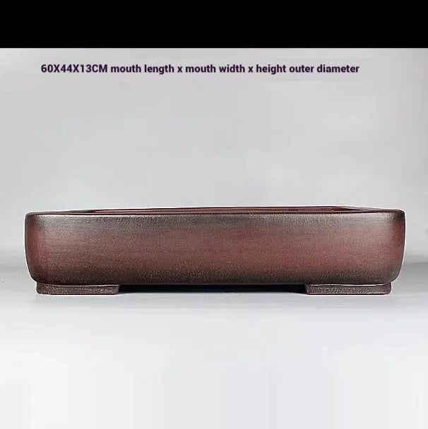 Handmade rectangular purple clay flower pot with antique finish showing natural colour variation