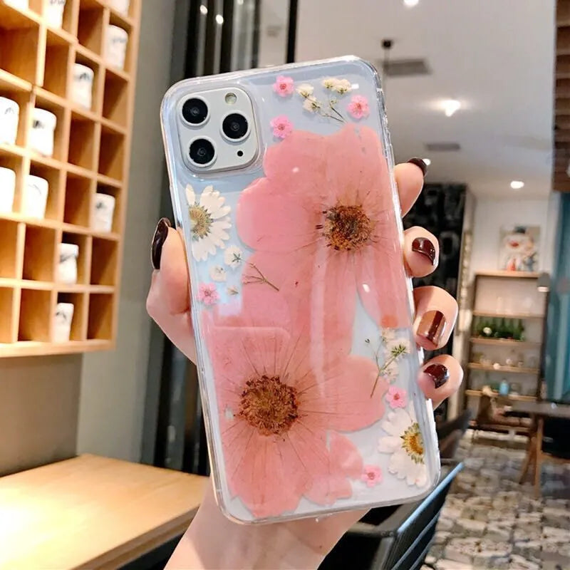 Floral TPU phone case with large pink flower design on back, shown fitted on an iPhone.