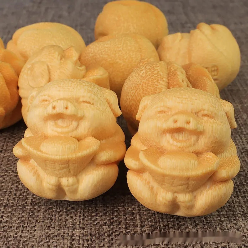 Solid bamboo pig carving ornament measuring 4cm tall with 3.5cm diameter