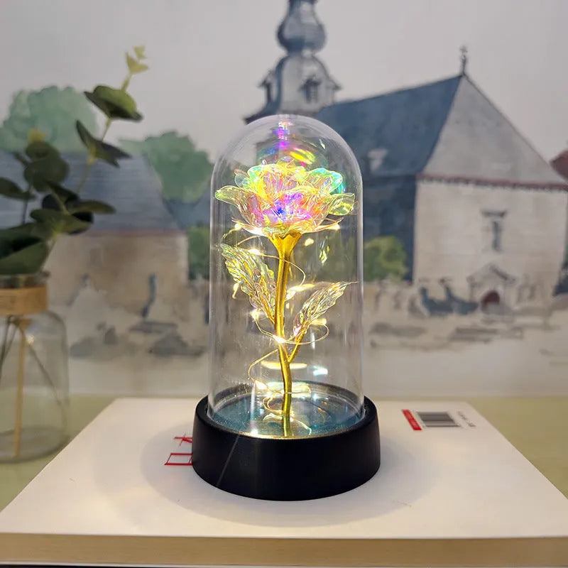 Glass cover small night lamp with plastic flowers in 15cm tall design with black base