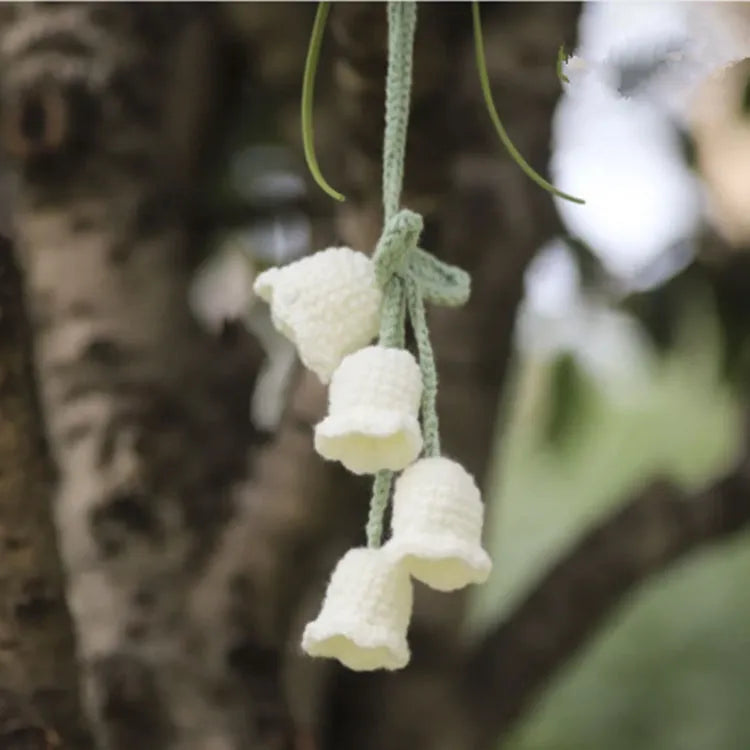 Green and white fish-scale style knitted wool car hanging planter with 8cm base and long white cord.
