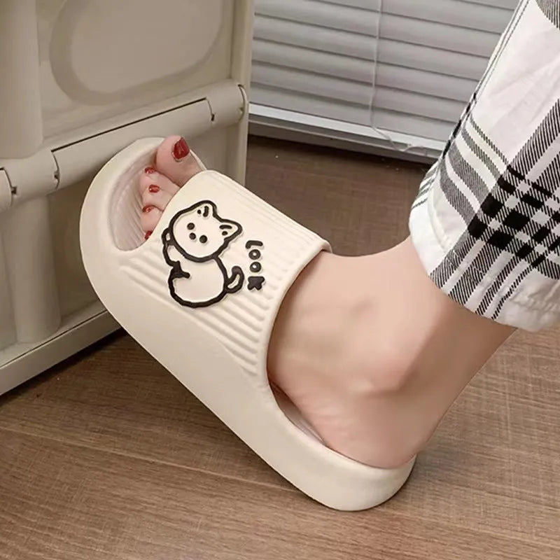 Green EVA foam cat slippers with thick platform sole and anti-slip pattern.