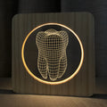 Tooth shaped wooden colour acrylic night lamp with USB cable on white background
