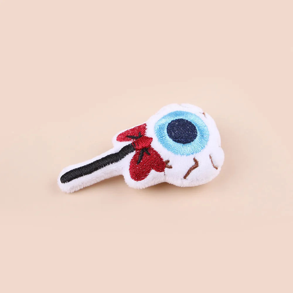 Small plush cat teaser wand with candy and skull designs for indoor play