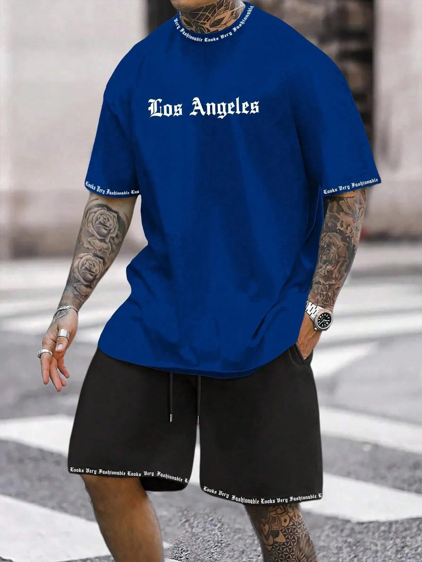 Sports-style short sleeve shirt and matching shorts set in a printed pattern, shown in colour G23P1573.