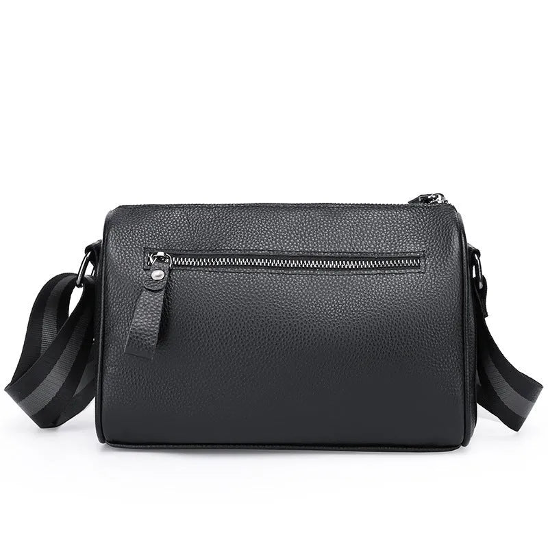Black genuine leather crossbody bag with polyester lining measuring 24x16x13cm