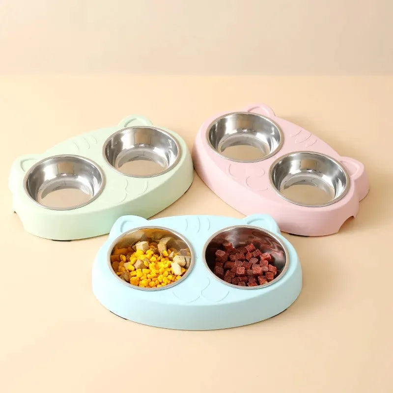 Blue plastic double bowl pet feeder tray with non-slip feet for holding cat or dog food and water dishes.
