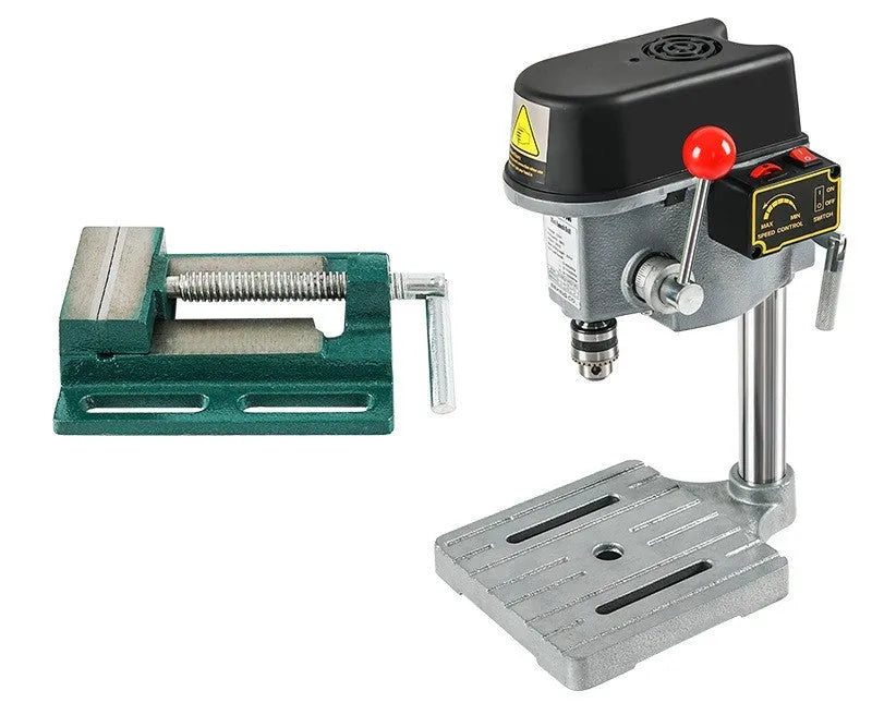 Mini bench drill and milling machine with heavy-duty bench pliers on a workbench.