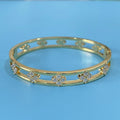Gold and silver women's bracelets with hollow design and four-leaf clover zircon charms.