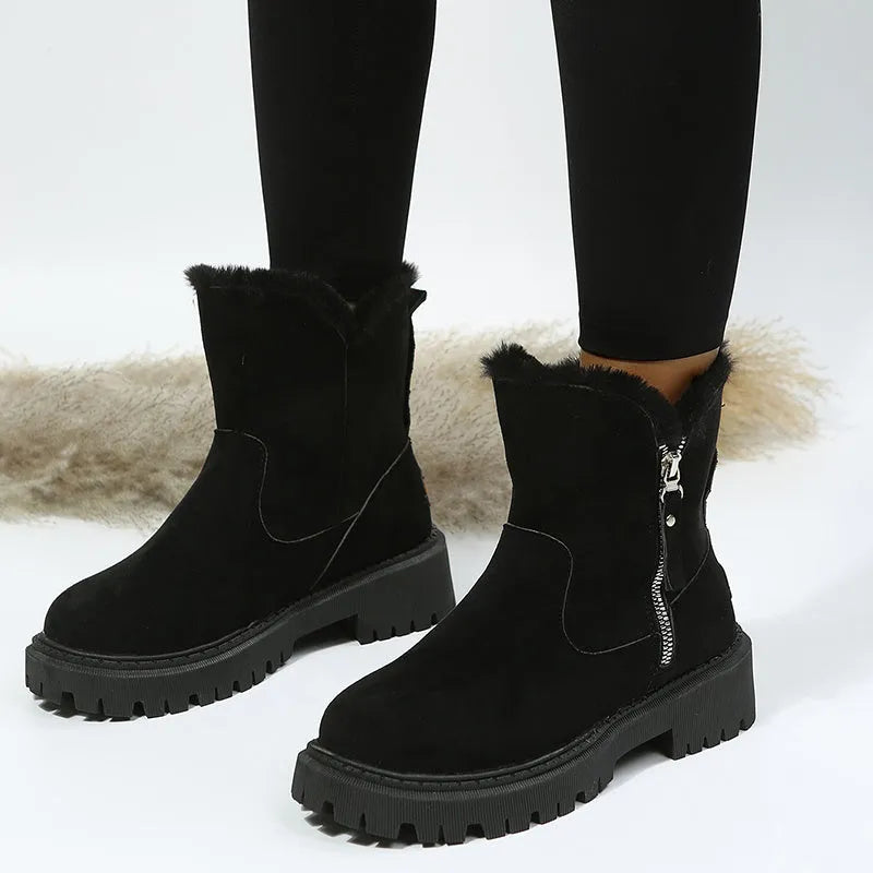 Women's black high-top snow boots with side zipper and round toe, made from cow suede.
