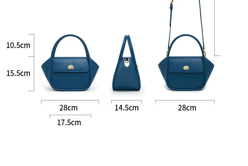 Brown leather wing-shaped tote bag with a buckle detail and latch closure, shown with a single cross-body strap.