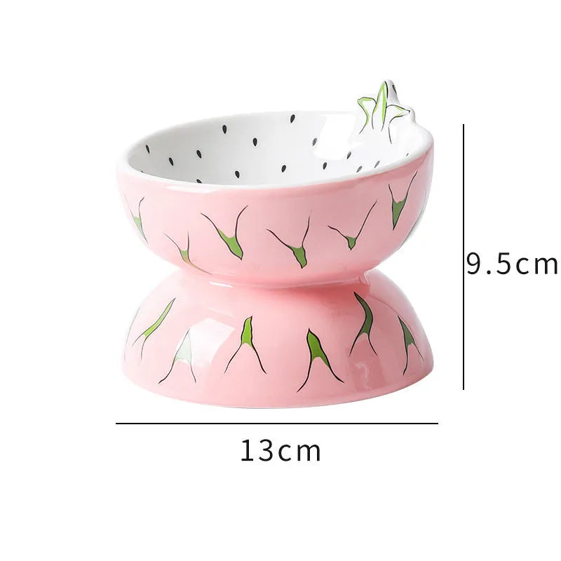 Ceramic raised cat bowl in orange pattern, showing tilted wide-rim design on elevated stand.