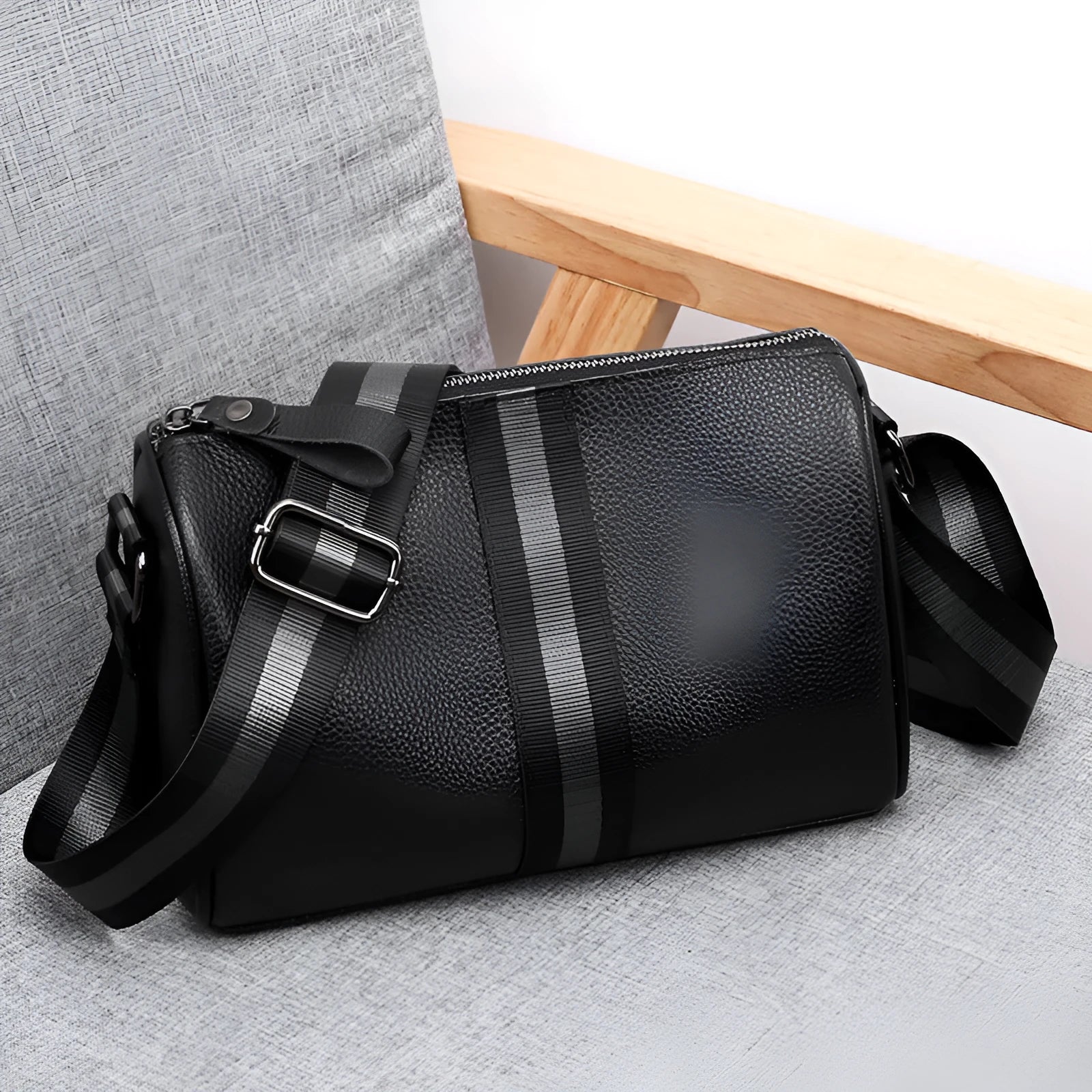 Black genuine leather crossbody bag with polyester lining measuring 24x16x13cm