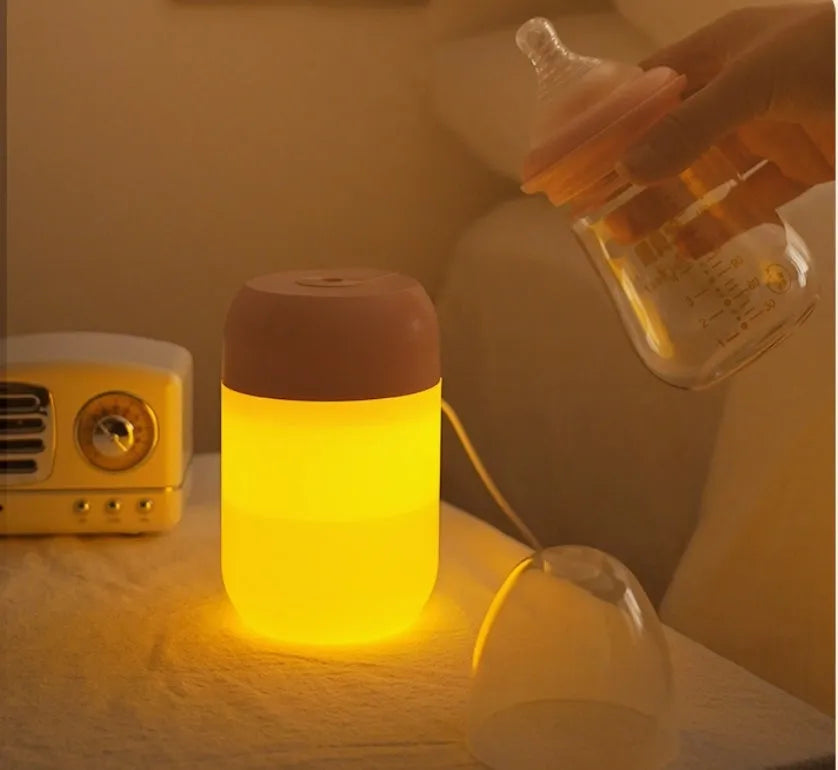 White cylindrical USB-powered mini humidifier with aromatherapy function on desk