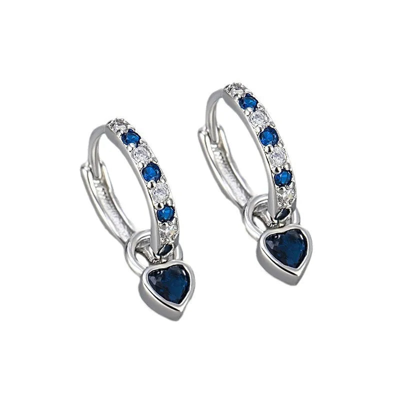 Women's gold tone earrings with a heart-shaped clip and a pink zircon drop pendant.