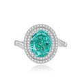 S925 sterling silver women's ring with ellipse emerald and inlaid high carbon diamond in geometric setting.
