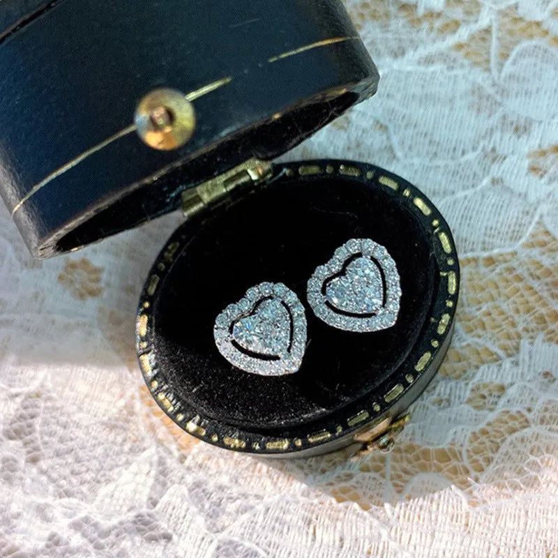 White zircon heart stud earrings with electroplated finish, post-back closure, compact design