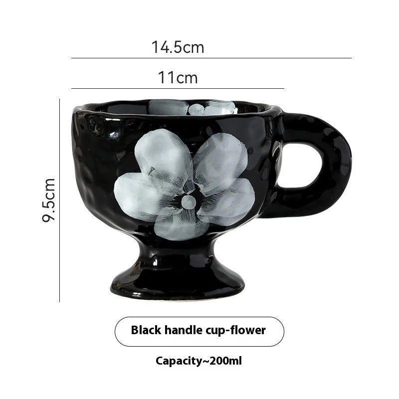 Hand-pinched irregular shaped ceramic mug in a solid colour, modern simple design