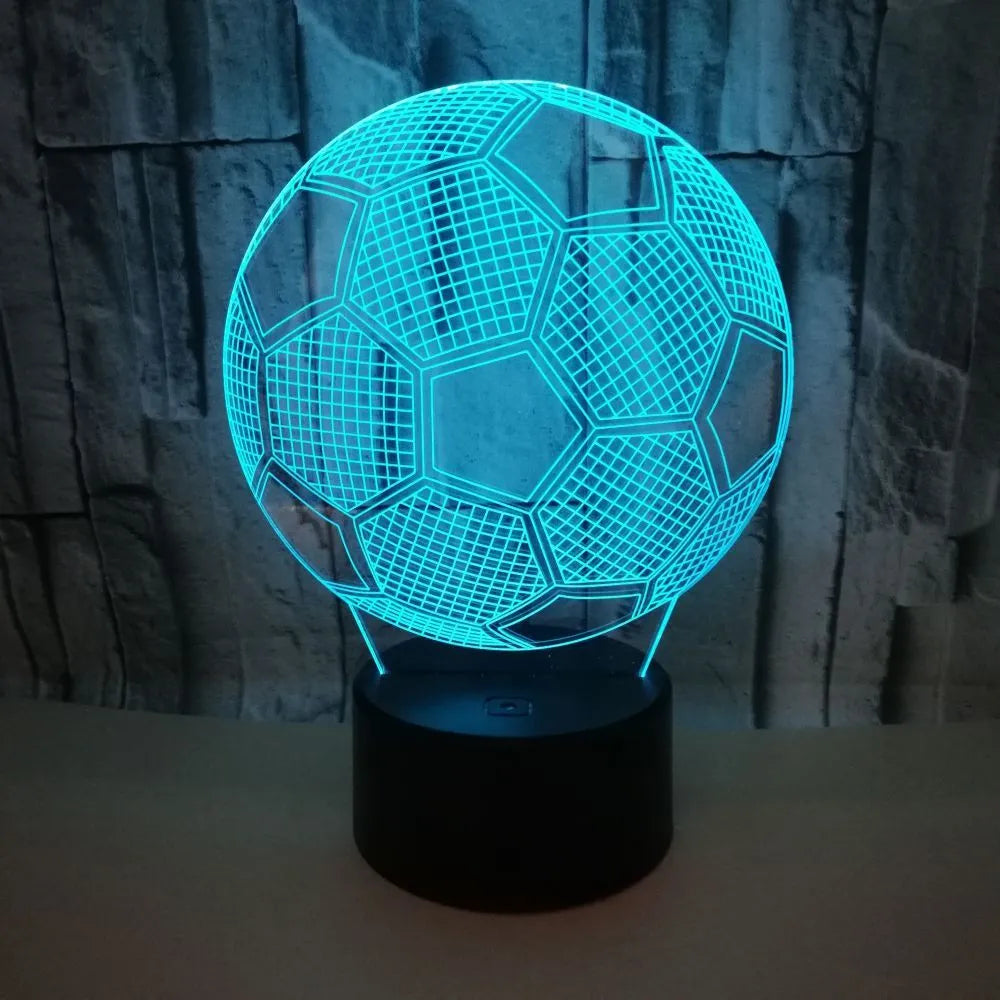 3D football-shaped night light showing multicolour illumination on acrylic surface