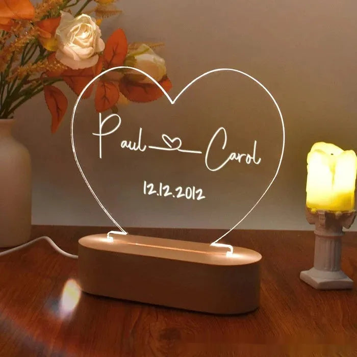 Custom acrylic LED night light displaying personal names and date, 20cm by 11.5cm, with USB cable.