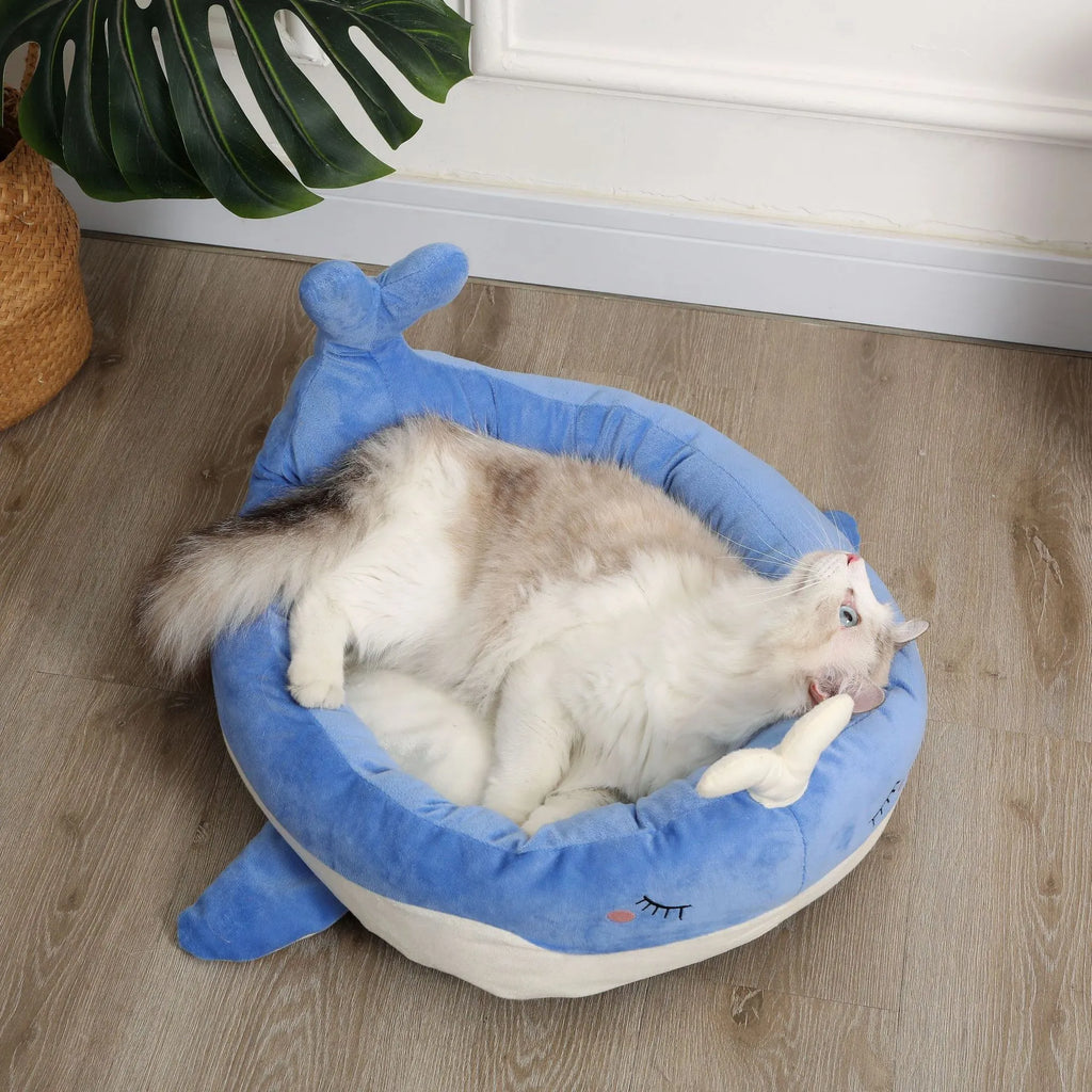 Blue duck-shaped fluffy pet bed sofa for small dogs and cats on a floor.