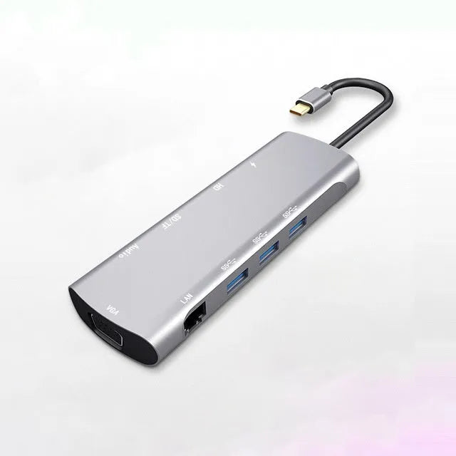 Grey aluminium USB-C docking station with HDMI, VGA, USB port, and a 140mm cable.