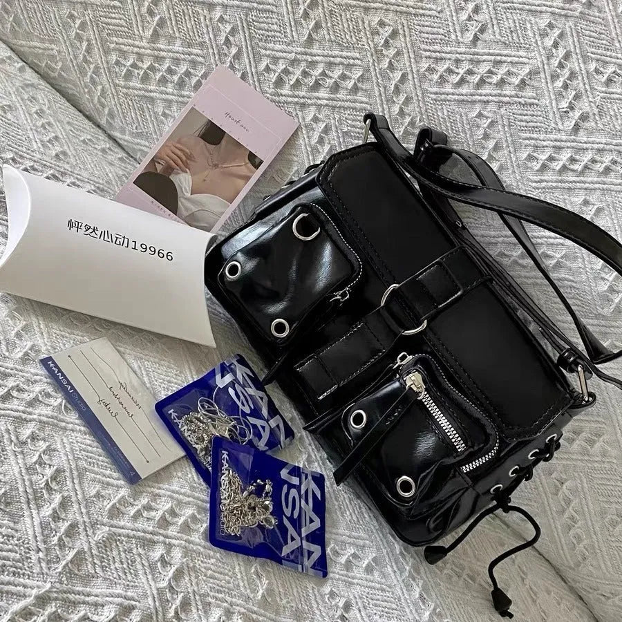 Black structured PU women's baguette messenger bag with crossbody strap.
