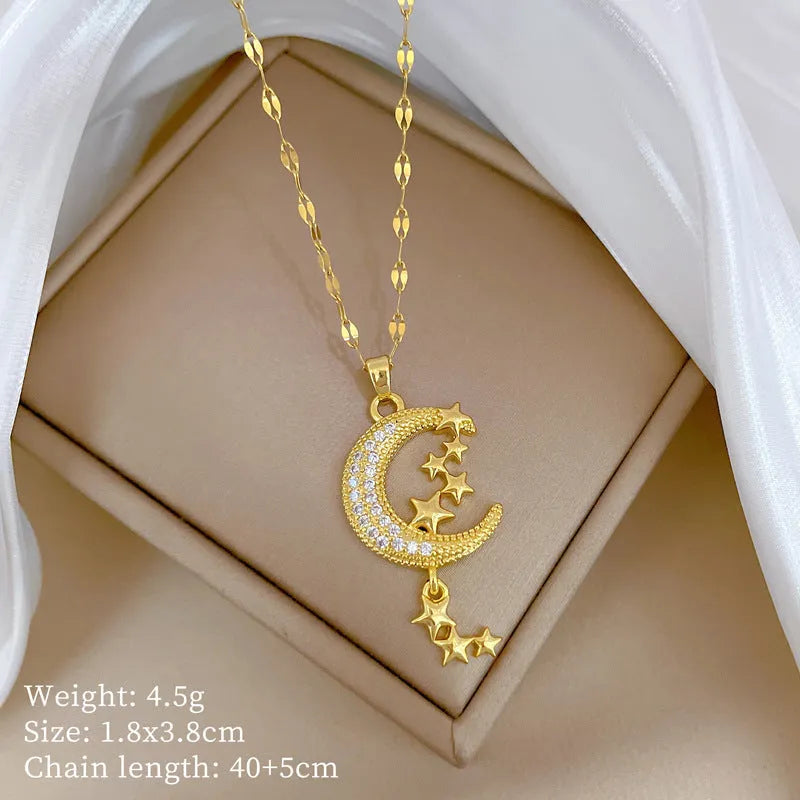 Moon and diamond tassel pendant necklace with geometric copper detail on a stainless steel chain.