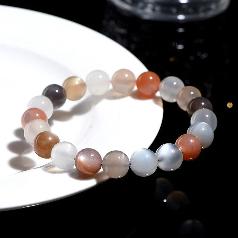 Natural colourful moon light moonstone duobao bracelet with 8mm beads on an adjustable band.
