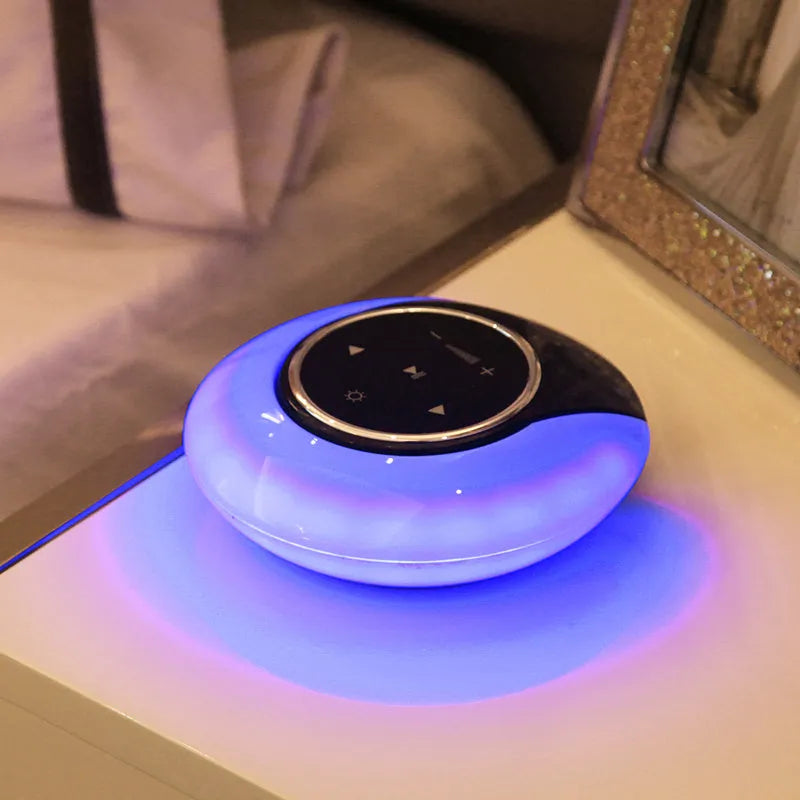 Square blue Bluetooth speaker lamp with touch controls, showing white LED light and folding design.