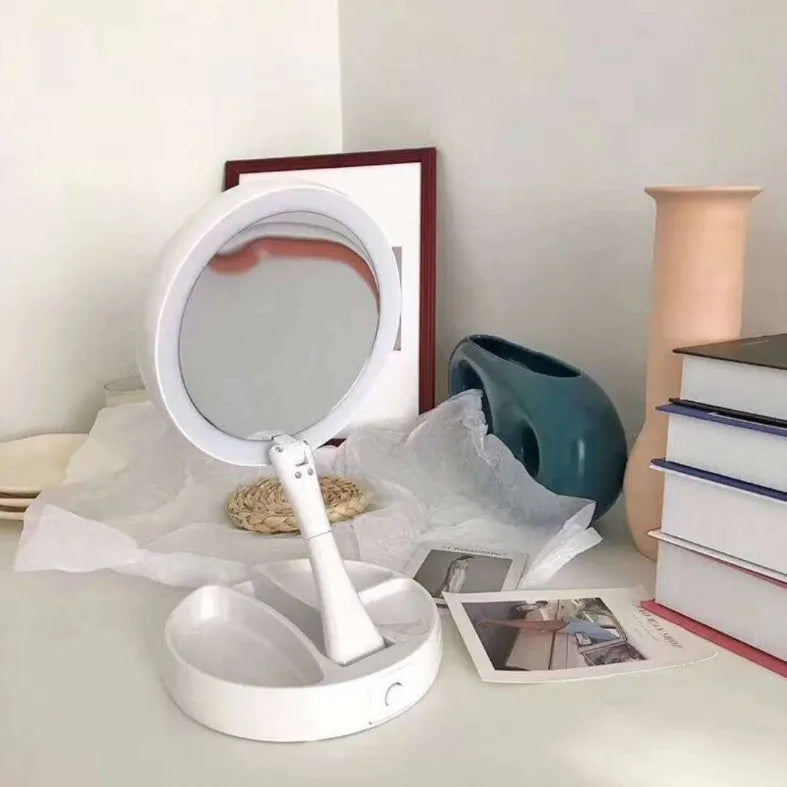 White foldable LED vanity mirror showing 1x and 5x magnification sides and USB charging port.