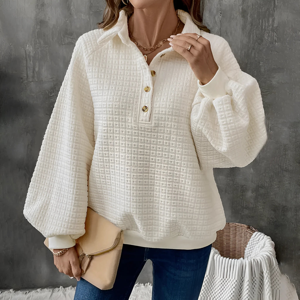 Women's milky white polo collar sweater with long sleeves and textured fabric.