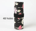 Square canvas rolling pencil case with ballet girl print, unfurled to show multiple pencil slots.